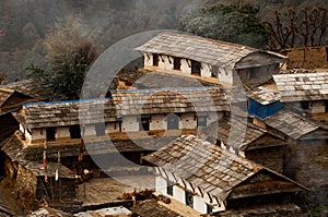 Houses and smoke hearth in a Nepalese village. House in a Nepalese village. Traditional Nepalese house, trekking to the Annapurna