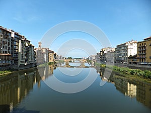 Houses on the southern bank of the Arno river in Florence, Italy. View of Florenceâ€™s Ponte Santa Trinita