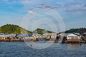 houses on stilts in Yellu village at sunset