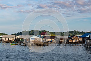 houses on stilts in Yellu village at sunset