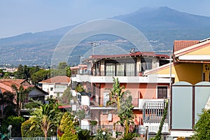 Houses on street in Giardini Naxos and Etna mount