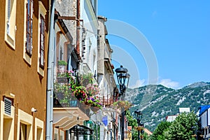 Houses on a street in the town of Cetinje with a view of the mountains, Montenegro