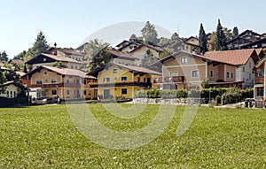 Houses surrounded by meadows