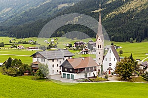 Houses surrounded by meadows