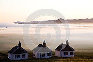 Houses in thick fog