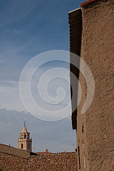 Houses and tower of a church. Bello.