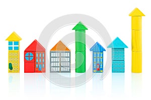 Houses and towers builded from colorful wooden blocks isolated on white background with shadow reflection.