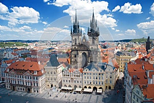 Houses with traditional red roofs in Prague Old Town Square in t