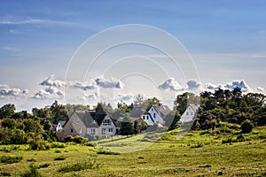 Houses under the clouds on the island Hiddensee. Panorama of Hiddensee photo