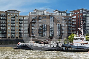 Houses and Watercrafts along the River Thames near the Canary Wharf