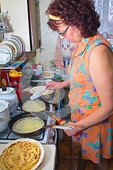 Housewife bakes pancake