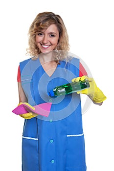 Housewife with blond hair and damp cloth starts cleaning