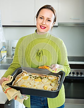 Housewife cooking filleted fish