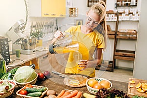 Housewife cooking orange juice, bio food