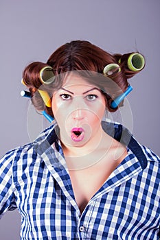 housewife with curlers. pin up portrait