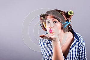 housewife with curlers. pin up portrait