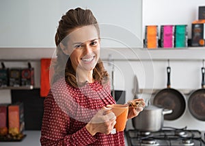 Housewife drinking tea with freshly pumpkin bread