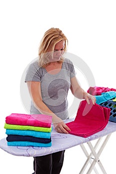 Housewife is folding towels