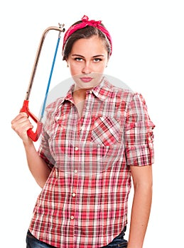 Housewife in kerchief with handsaw