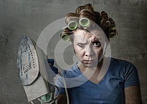 Housewife sad bored and stressed holding iron angry and frustrated