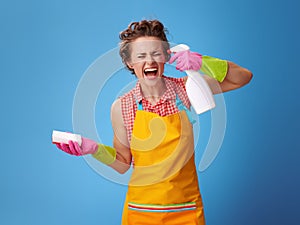 Housewife with sponge wanting to shoot herself from a bottle