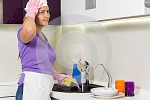 Housewife straightening her cap as she works