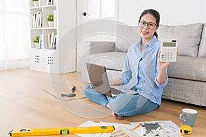 Housewife using computer planning house remodeling