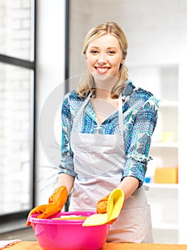 Housewife washing dish at the kitchen