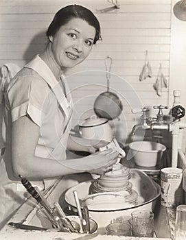 Housewife washing dishes photo