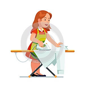 Housewife woman ironing shirt using iron and board