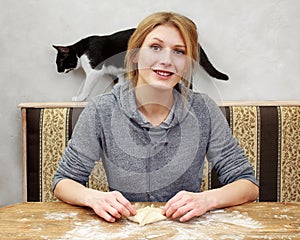 Housewife. Woman is sitting on a kitchen, cooking