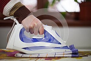 Housewife work, a housewife does her job,iron and ironing board, ironing