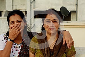 Housewives laughing together