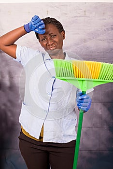 Housework concept. Housekeeper holding a broom