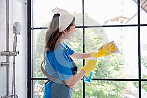 Housework or house keeping service female cleaning dust in toilet, cleaning agency small business. professional equipment cleaning