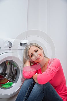 Housework: young woman doing laundry