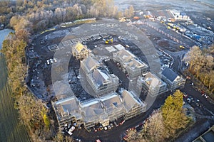 Housing development aerial view in construction on rural countryside site Scotland UK