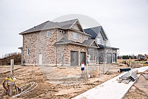 Housing develpment with houses in countruction on a cloudy day