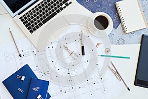 Housing plan blueprint on desk