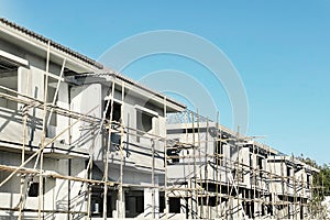 Housing real estate business presentation background with perspective row of housing project under construction on site and