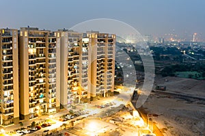 Housing skyscrapers in gurgaon at dusk with skyline