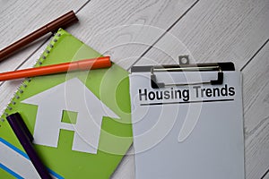 Housing Trends text write on paperwork isolated on office desk photo