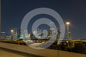 Houston downtown from freeway 10 at night photo