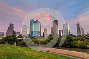 Houston Texas skyline at sunset twilight from park lawn