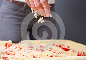 Houswife preparing pizza