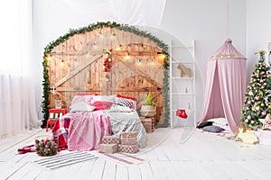 Hovel prepared for children. Beautiful New Year decor of the children room Christmas house.