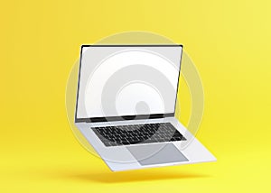 Hovering aluminium flying laptop with blank screen new design on yellow background, modern computer monitor closeup flying