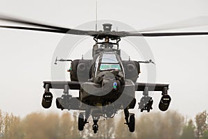 A hovering Apache attack gunship helicopter photo
