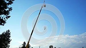 Hovering with rope from high tower, man bouncing on string, jumping with insurance from height