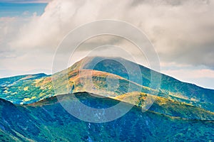 Hoverla mountain peak in clouds